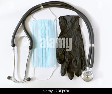 COVID-19, 2019-nCov novel coronavirus concept. Creative layout made with disposable medical or Surgical latex black glove, stethoskope and medical Stock Photo