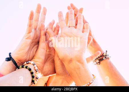 group of caucasian females hands united in team concept - help each other and stay together in life - solidarity people and togetherness close up imag Stock Photo