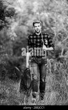 Big game fishing. fisher hold fish net. hobby. man checkered shirt on  ranch. fisherman with fishing rod. man in cowboy hat. western portrait.  Vintage style man. Wild West retro cowboy. fly fishing Stock Photo - Alamy