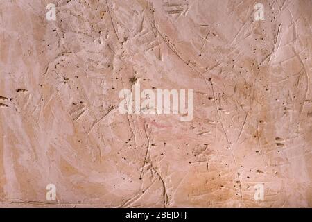 plaster structure scratched and yellowed Stock Photo