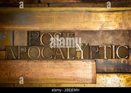 Photo of real authentic typeset letters forming Post Apocalyptic text on vintage textured grunge copper background Stock Photo