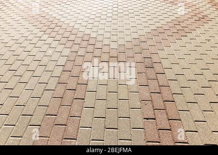 Top view on paving stone road. Old pavement of granite texture. Street cobblestone sidewalk. Abstract background for design. Stock Photo