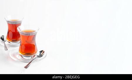 Two cups of turkish tea on a white background. Turkish traditional cuisine. Isolate Stock Photo