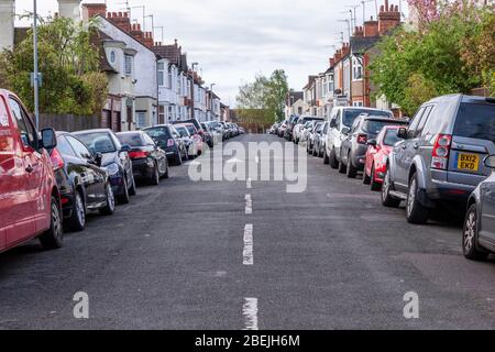 Northampton, UK. 14th April 2020. Parked cars in Sandringham road with people working from home because of the coronavirus, on the day after the Easter Bank holiday weekend when it would usually be busy with commuters going of to work. Credit: Keith J Smith./Alamy Live News Stock Photo