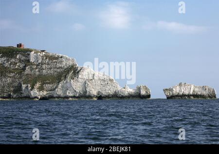 The Needles and the Coastguard Station on Tennyson Down, Isle of Wight, England, UK, from seaward in the Needles Fairway, on a calm Summer's day Stock Photo