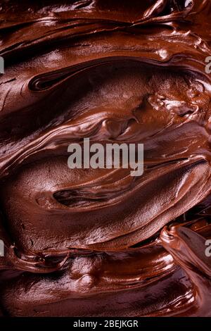 background of melted chocolate in the foreground with top view Stock Photo