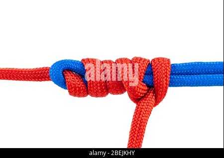 Two red and blue cords are connected . Knot on a cord isolated on a white background . Stock Photo