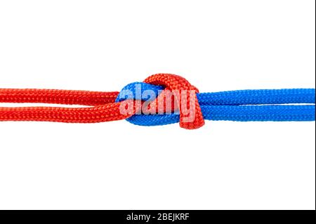 Two red and blue cords are connected . Knot on a cord isolated on a white background . Stock Photo
