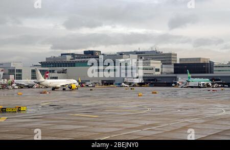 Gatwick, UK - January 3, 2020: Planes at the South Terminal of Gatwick Airport on a sunny new year morning in West Sussex. Stock Photo