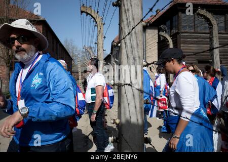 Oswiecim, Poland - 12 April 2018: International Holocaust Remembrance Day. Thousands of judes with Israeli flag come to Auschwitz to join and pray The Stock Photo