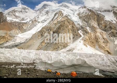 A small camp of climbers, beneath the Gasherbrum Mountains in the Karakoram range in Northern Pakistan. Stock Photo