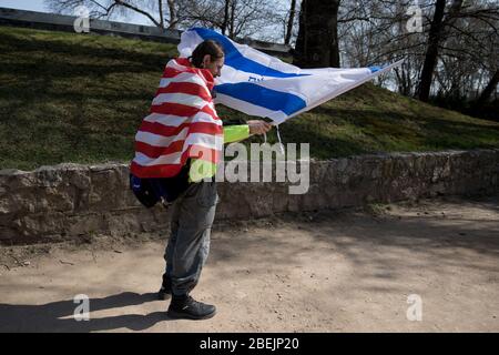 Oswiecim, Poland - 12 April 2018: International Holocaust Remembrance Day. Thousands of judes with Israeli flag come to Auschwitz to join and pray The Stock Photo