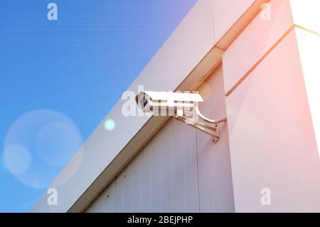 Silver CCTV Camera on the white wall Stock Photo