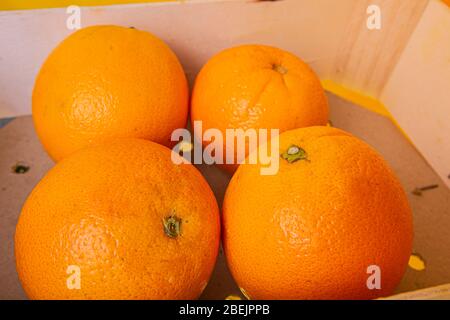Close-up of  fresh orange peel over yellow background. Bio and healthy food. Stock Photo