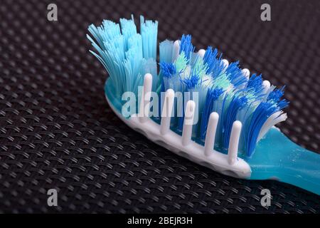 Macro close up of toothbrush on black background Stock Photo