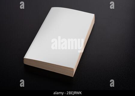 Book with blank cover on black background, editable mock up template ready for your design, clipping path included Stock Photo