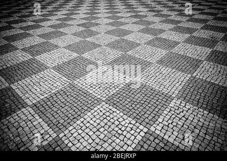 Typical stone floor Lisbon, detail of a typical floor with shapes and drawings, art Portugal, tourism Stock Photo