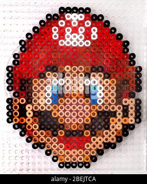 The computer game character Super Mario made from Hama Beads Stock Photo
