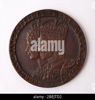 A British Coin with George the 5th and Mary Queen Consort to Commemorate their Coronation in June 1911 Stock Photo