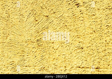 Texture of yellow concrete or plastered wall. Abstract background for design with copy space for text. Stock Photo
