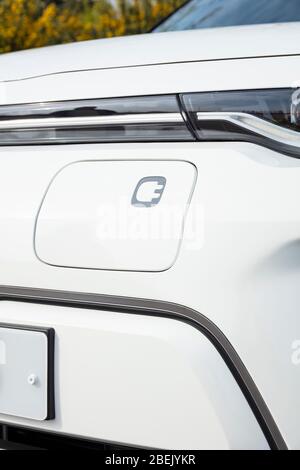New electric car Kia E Soul registered march 2020 electric car charging port on the front of the vehicle. electric vehicle Stock Photo