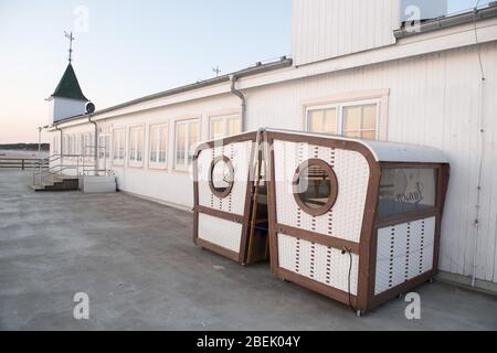 Ahlbeck, Germany. 12th Apr, 2020. Closed are the snack beach chairs on the pier on the beach of the Baltic resort Ahlbeck. To slow down the spread of the coronavirus, exit restrictions are currently in place. Credit: Stefan Sauer/dpa-Zentralbild/dpa/Alamy Live News Stock Photo