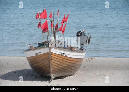 Ahlbeck, Germany. 12th Apr, 2020. A fishing boat stands on the Baltic Sea beach of Binz on the island of Rügen. Credit: Stefan Sauer/dpa-Zentralbild/dpa/Alamy Live News Stock Photo