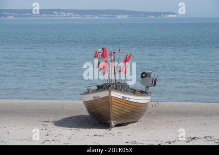 Ahlbeck, Germany. 12th Apr, 2020. A fishing boat stands on the Baltic Sea beach of Binz on the island of Rügen. Credit: Stefan Sauer/dpa-Zentralbild/dpa/Alamy Live News Stock Photo