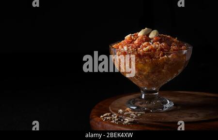 Gajar ka halwa kept in a serving bowl. Stock Photo