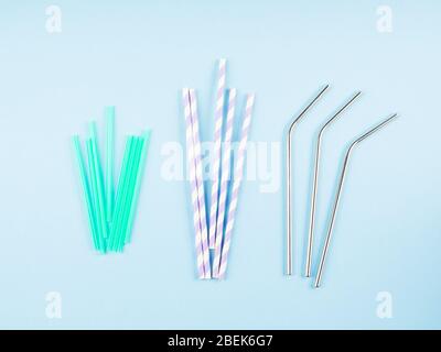 Different material drinking straws on pastel blue Stock Photo