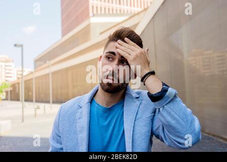 Young bearded man, model of fashion, in urban background wearing casual clothes. Stock Photo