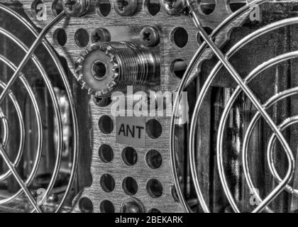 Rear panel of a high frequency power amplifier with vacuum tubes in black and white Stock Photo
