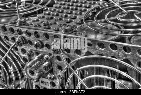 Rear panel of a high frequency power amplifier with vacuum tubes in black and white Stock Photo