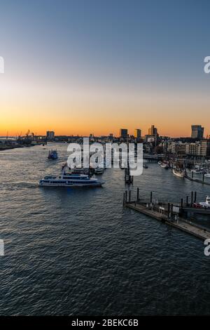 Panoramic view of the Port of Hamburg in the Hafen City at Elbe river at sunset/twilight