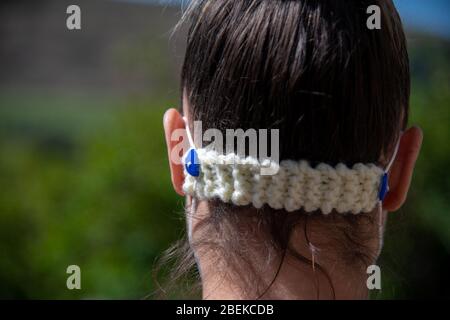 COVID-19 homemade DIY face mask with knitted back fastener to help healthcare medical workers with PPE shortage, handmade cotton Personal Protection Stock Photo