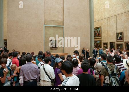 Paris, France - July 08 2008: People pushing and trying to get closer to take a picture of the painting La Gioconda at the Louvre museum Stock Photo
