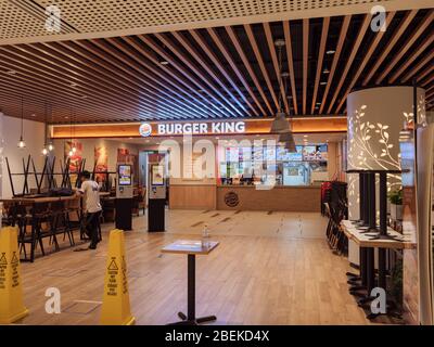SINGAPORE – 9 APR 2020 – An empty Burger King restaurant in Thompson Plaza. Only takeaway is allowed due to covid-19 / coronavirus circuit breaker mea Stock Photo