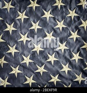 Retro styled image of the white stars against blue of the American flag Stock Photo