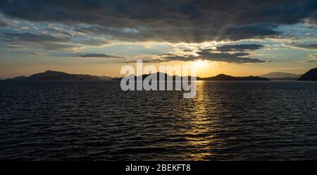 Sunset time in the Seto Inland Sea, Japan. Golden reflection on ocean surface Stock Photo