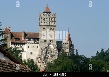 Exterior view of the 14th century Bran Castle in Romania. The Dungeon, taller than the rest of the castle, has an observation post and is set in stone Stock Photo