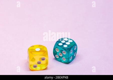 two translucent dices on pink background Stock Photo