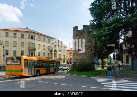 Orange bus and architecture in the City of Bergamo, Italy, Europe Stock Photo