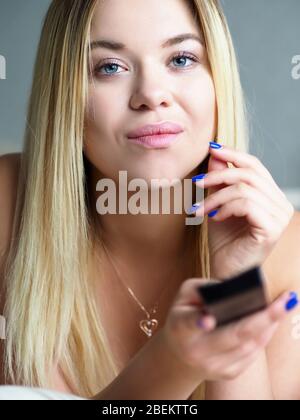 Attractive person watching television Stock Photo