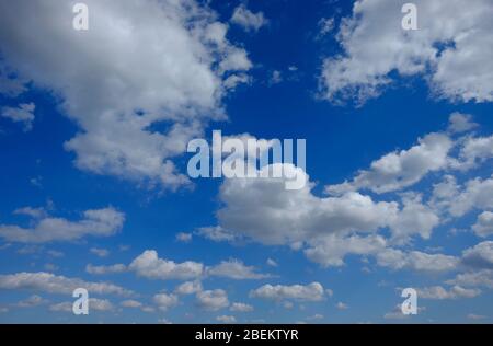 white clouds on bright blue sky Stock Photo