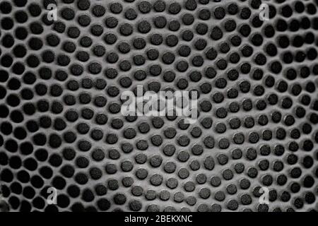 Abstract pattern texture background made of small black circles, close-up shot, selective focus. Stock Photo