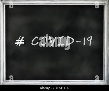 # COVID-19 written text on black chalkboard with white frame. Stock Photo