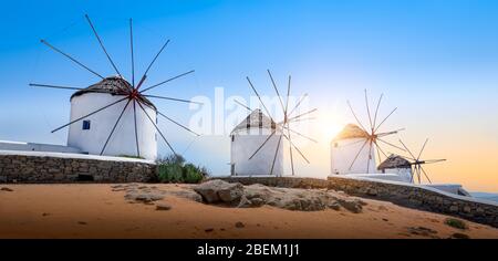 Mykonos, Greece. Famous white old windmills at sunset. Panoramic view. Stock Photo