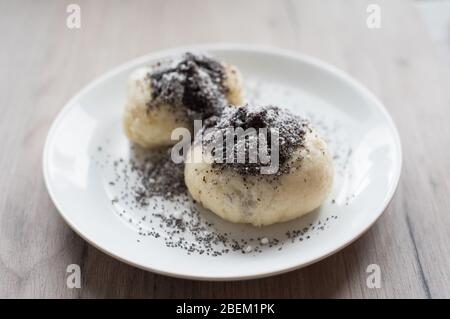 Traditional austrian czech yeast dumpling with poppy-seeds and sugar Stock Photo