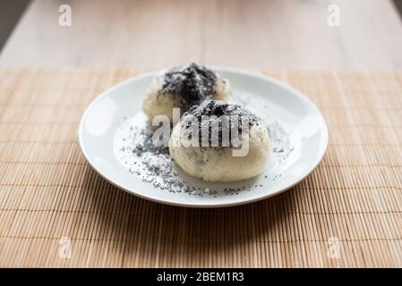 Traditional austrian czech yeast dumpling with poppy-seeds and sugar Stock Photo