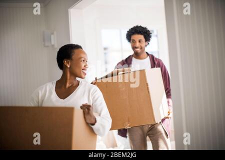 Happy couple moving into their new home Stock Photo